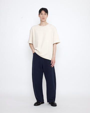 Relaxed Curve Legged Trouser - SS25 - Navy